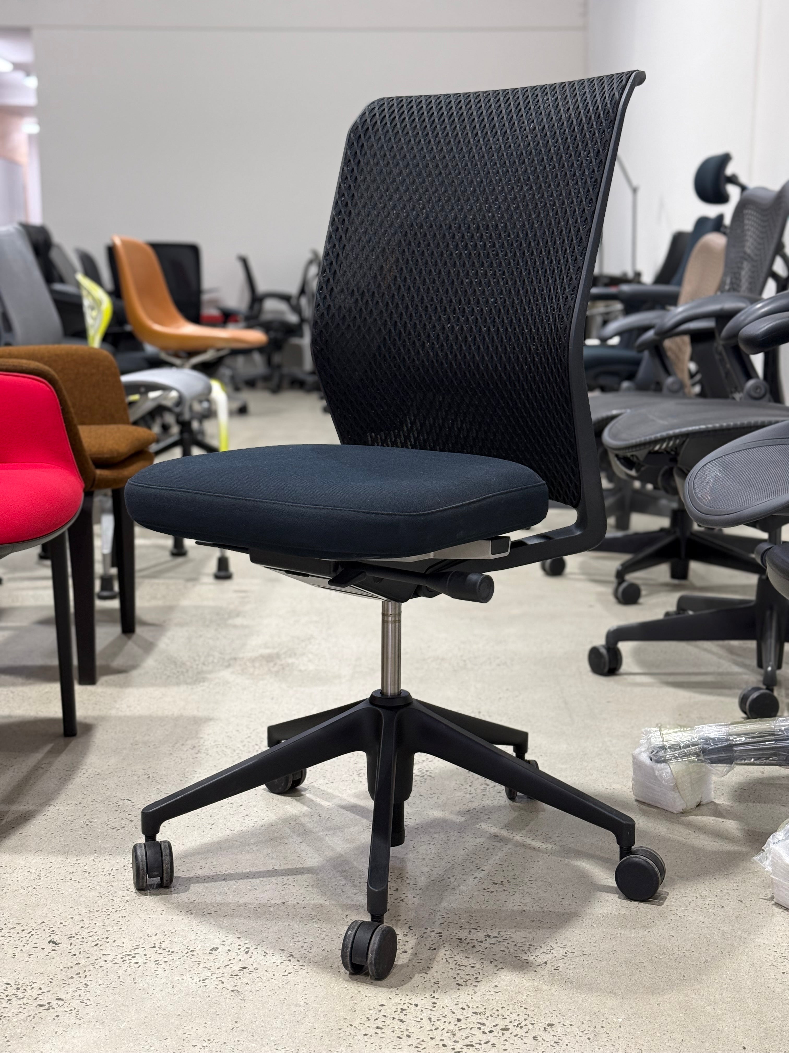 Authentic Vitra ID Mesh ergonomic office chair by Antonio Citterio in black mesh and black fabric. Premium commercial seating specified by architects, interior designers, workplace consultants and office fitout professionals. Suitable for executive offices, corporate workplaces and premium home offices. Available from Chairhub Melbourne with Australia-wide delivery. Popular alternative to Herman Miller Aeron and Embody, Steelcase Leap and Gesture, Haworth Fern and Zody, Schiavello and Okamura office seating